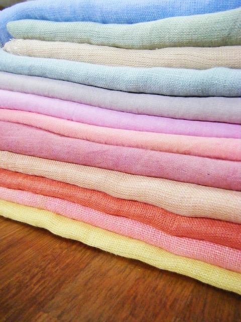 sustainable fabrics - a pile of linen fabrics