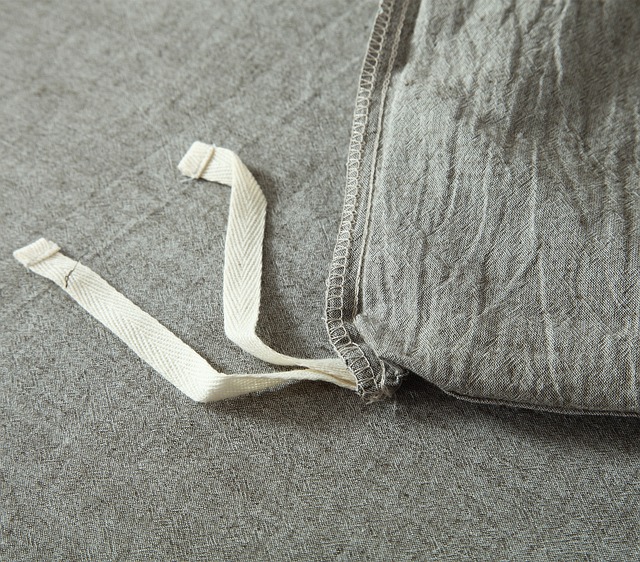 linen pillowcase on linen fabric - for an article about sustainable fabrics